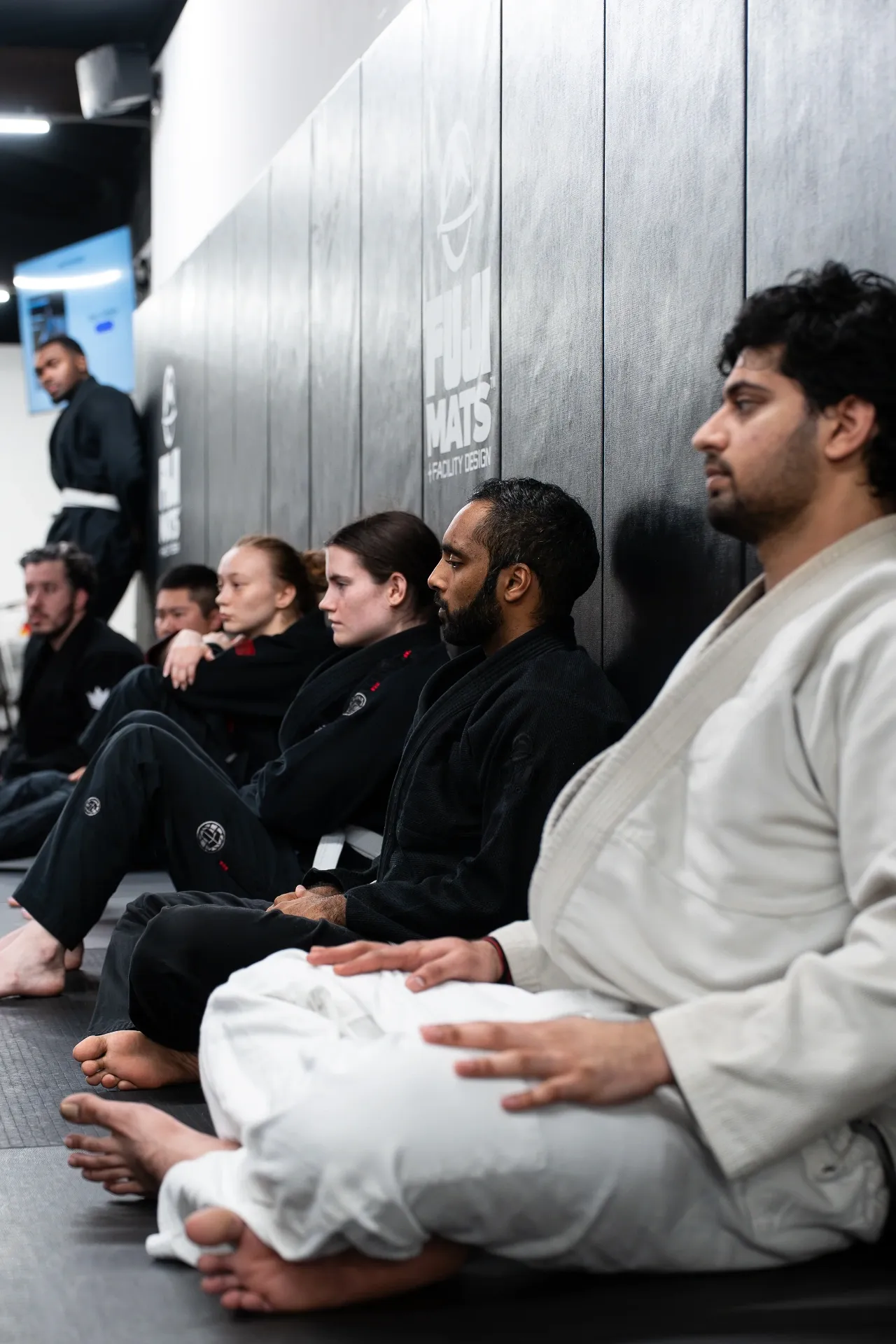 Adult students lined up before Jiu Jitsu class at Logic Philadelphia