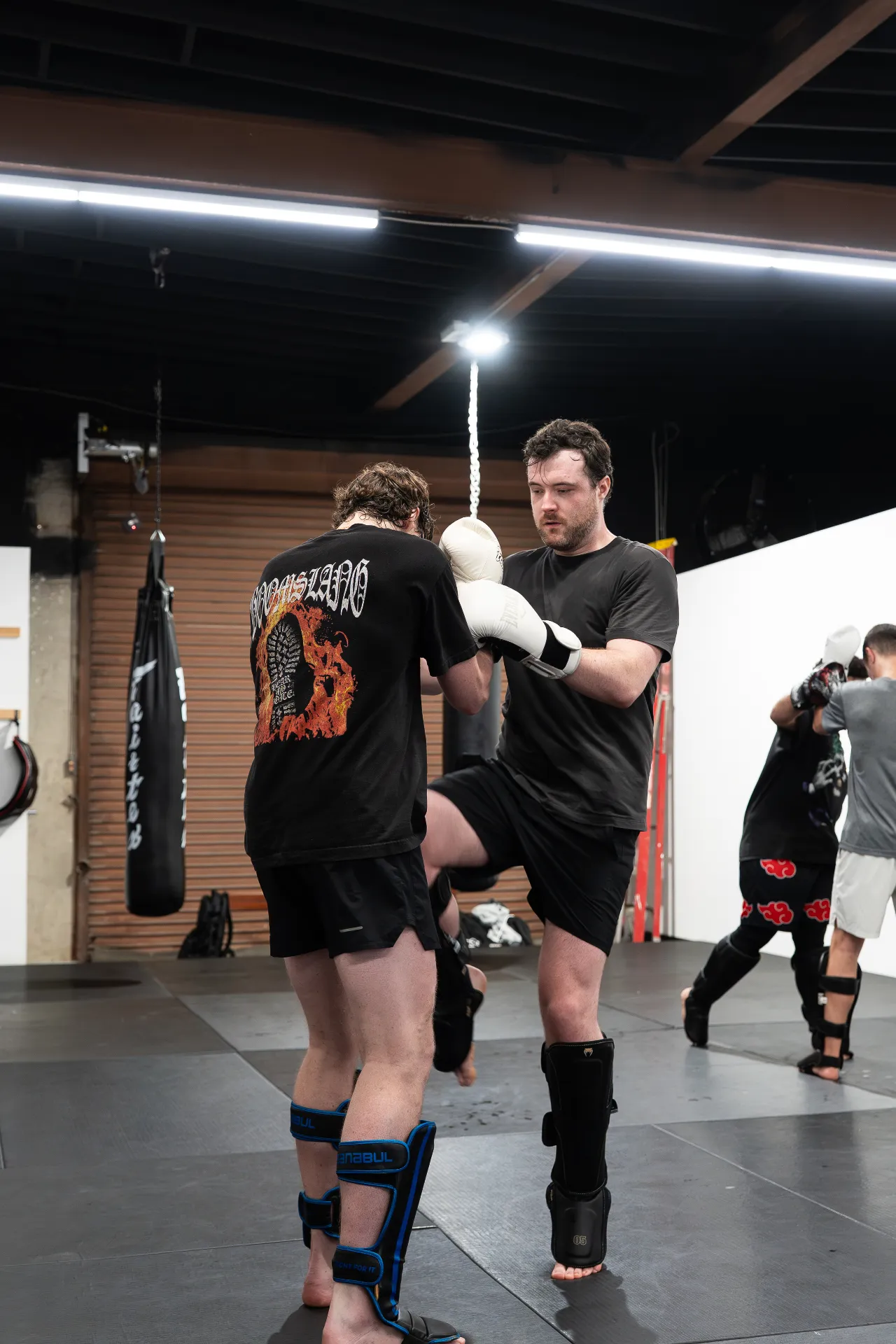 Coached partner drill in a Muay Thai class at Logic Philadelphia